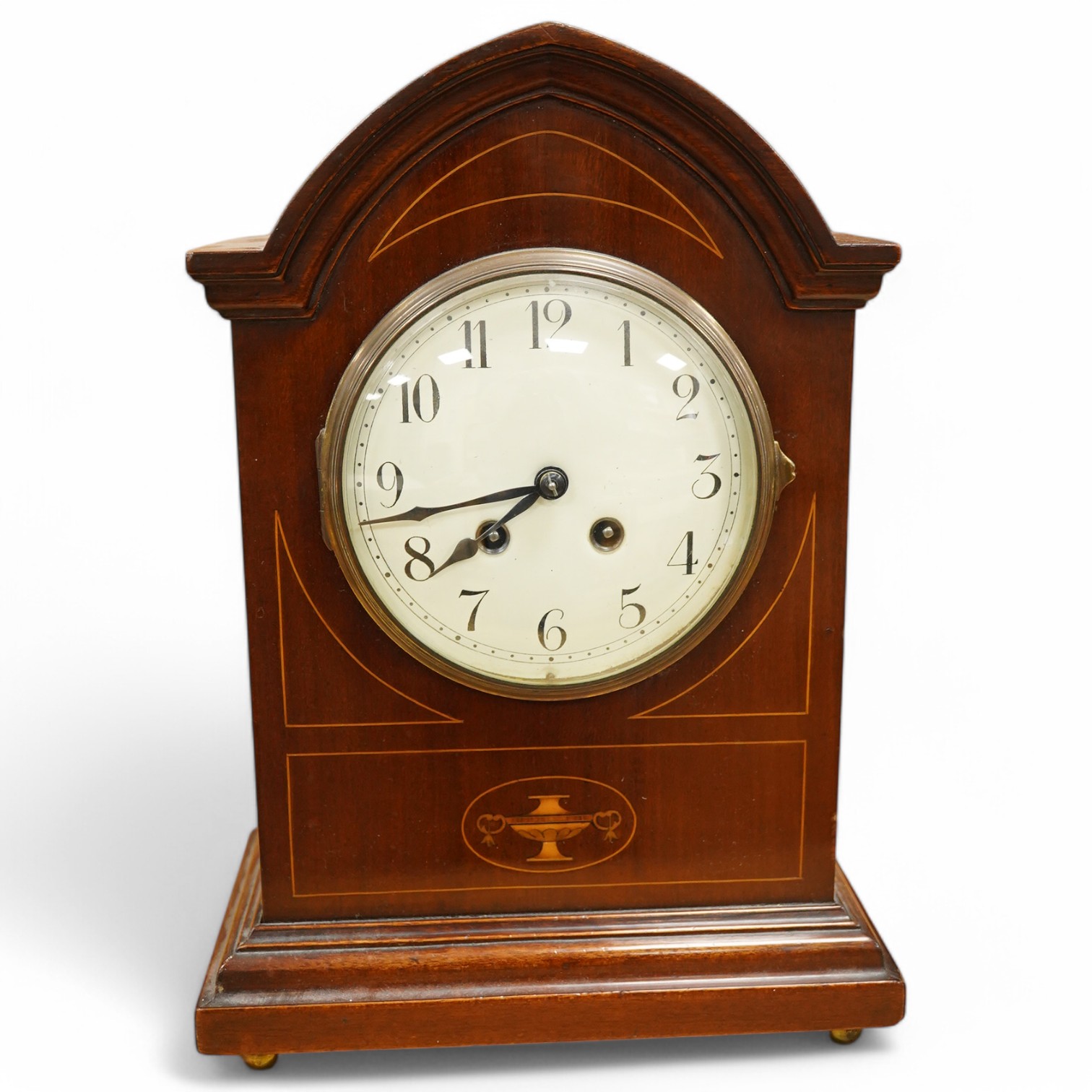 An Edwardian inlaid mahogany mantel clock striking on a coiled gong, 37cm. Condition - fair, untested